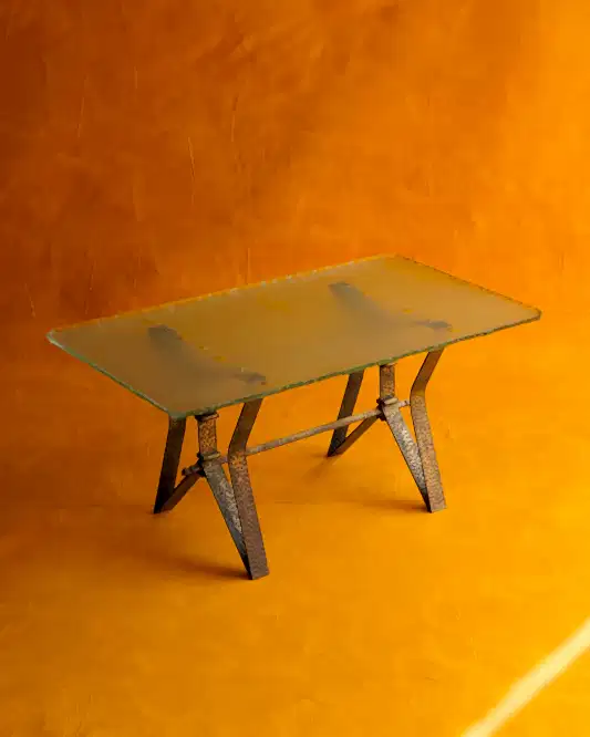 BRASS BASE COFFEE TABLE w. CARVED EDGED GLASS